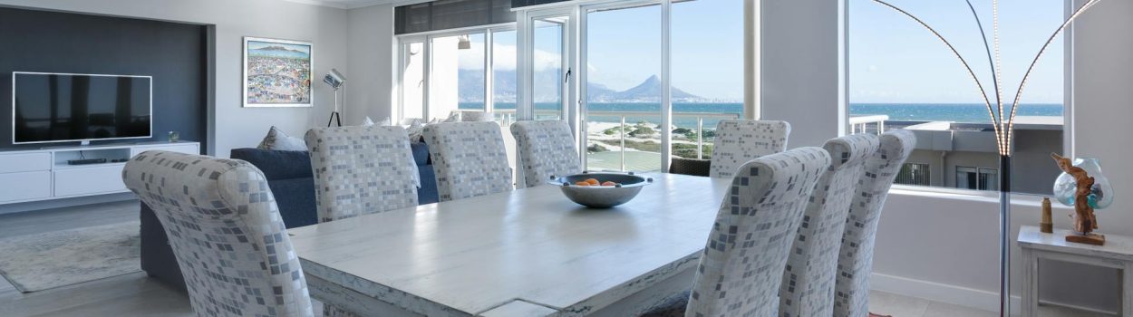 pexels-jvdm-1457841 open floor plan with upscale dining room and view of living room in background