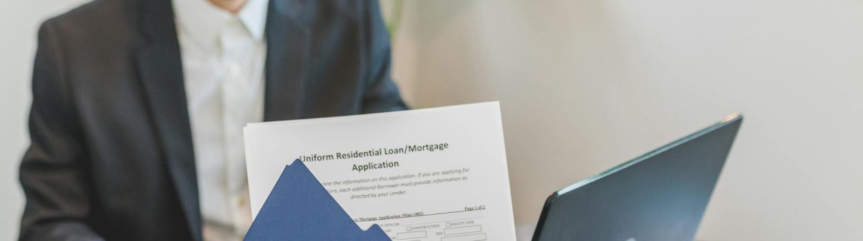 person holding loan documents