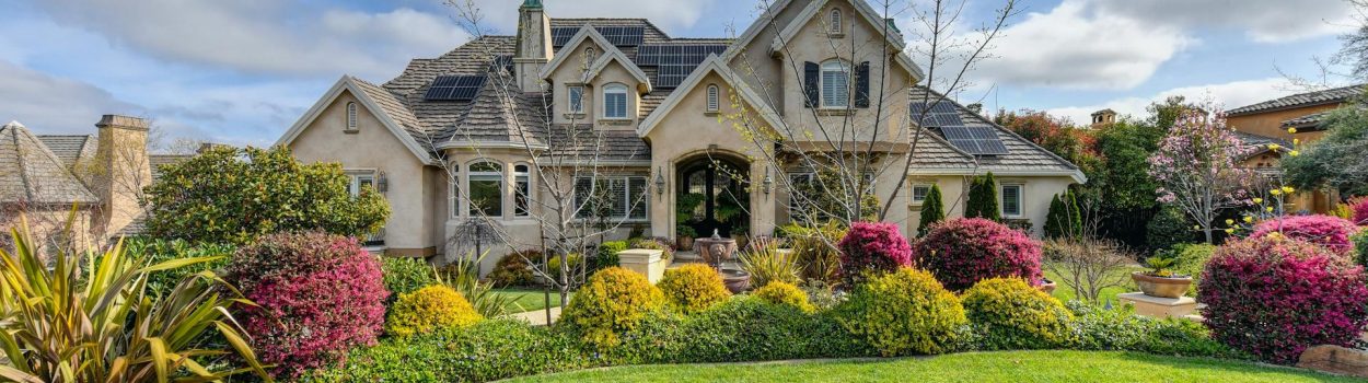 large home with manicured front yard